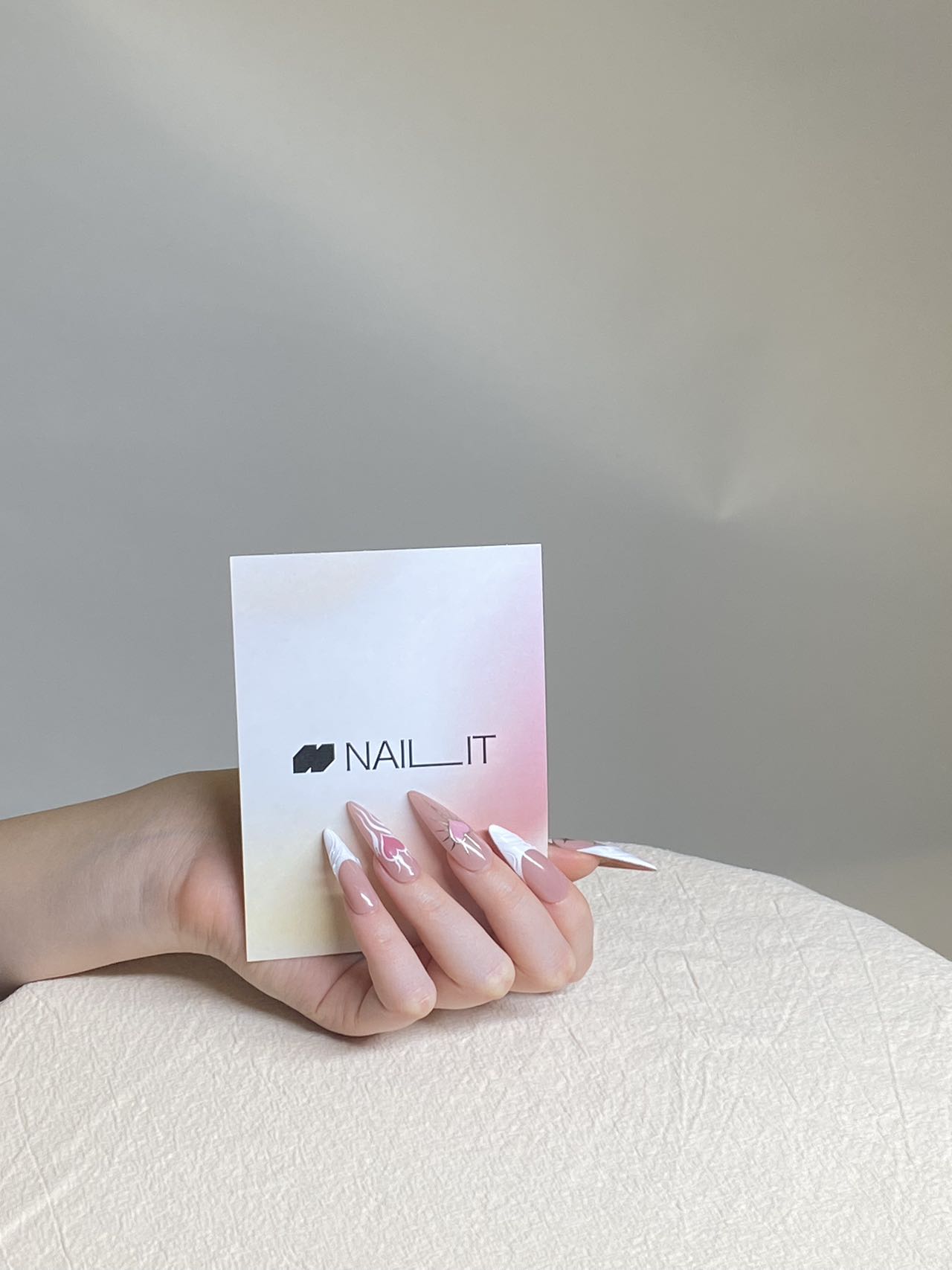NAILIT press-on nail sets displayed in branded primary packaging
